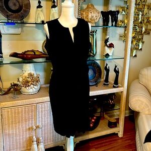 I am selling a black dress with zipper in back ruffle in front